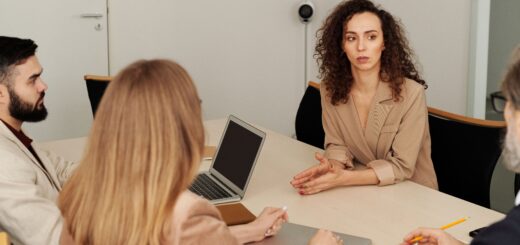Colleagues reviewing documents during a workplace meeting